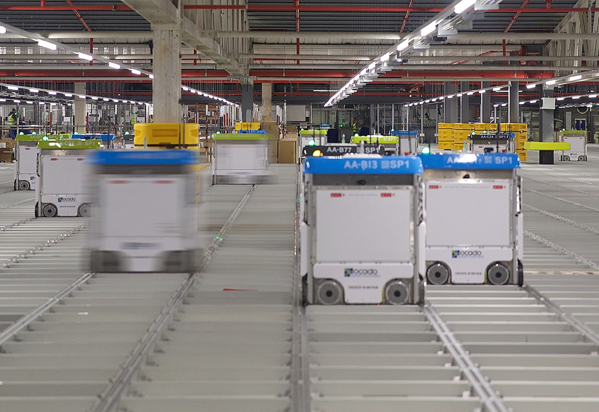 A warehouse with several carts

Description automatically generated with medium confidence
